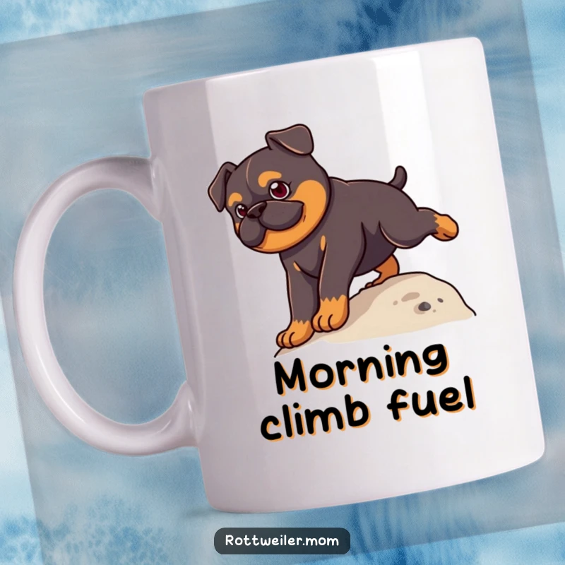 Funny Kawaii Rottweiler Mug showing a cute dog with a determined face, triumphantly climbing a small green hill.