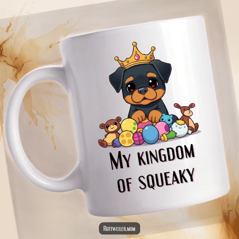 Funny Rottweiler King Mug shows a proud dog wearing a golden crown, looking over a hoard of colorful toys, exuding royal charm.