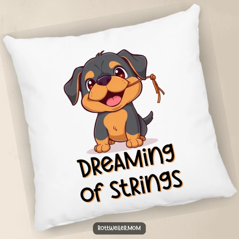 Funny Rottweiler pillow featuring a playful pup with happy eyes, batting at a dangling string, a soft and funny addition for comfort.