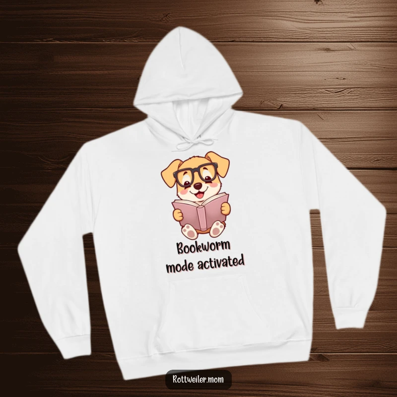 Funny hoodie with a dog wearing glasses, smiling while reading a book, ideal for cozy literary humor appreciation.