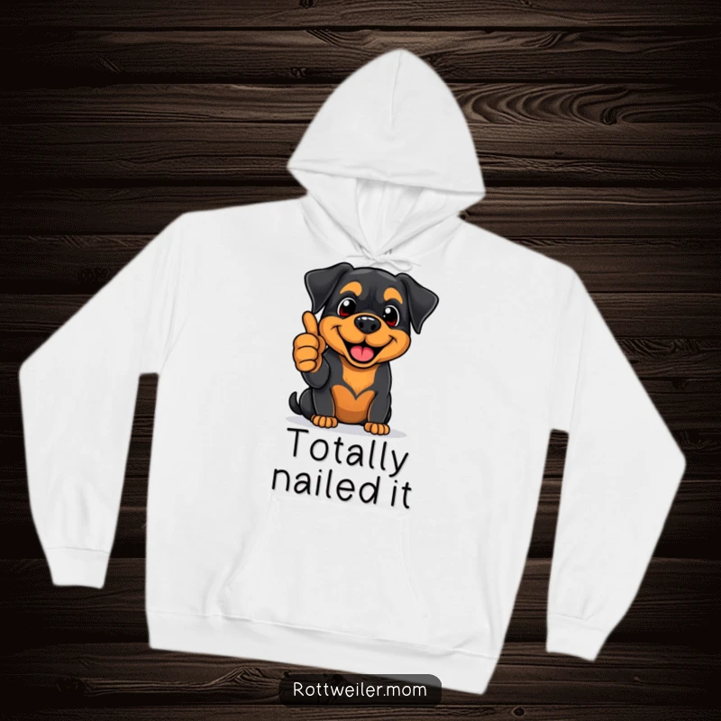 Funny Rottweiler hoodie featuring an enthusiastic pup giving a thumbs-up with a big smile, perfect for spreading warmth and positivity.