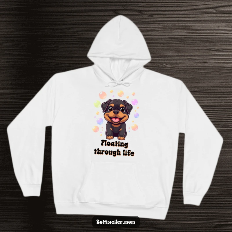 Funny hoodie featuring a smiling Rottweiler surrounded by floating, colorful bubbles, offering cozy comfort and playful humor.