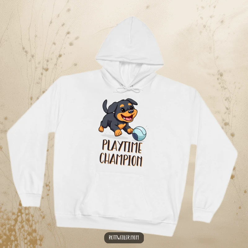 Funny hoodie depicting a kawaii Rottweiler with a silly grin, enthusiastically chasing a bouncing ball, perfect for dog lovers.