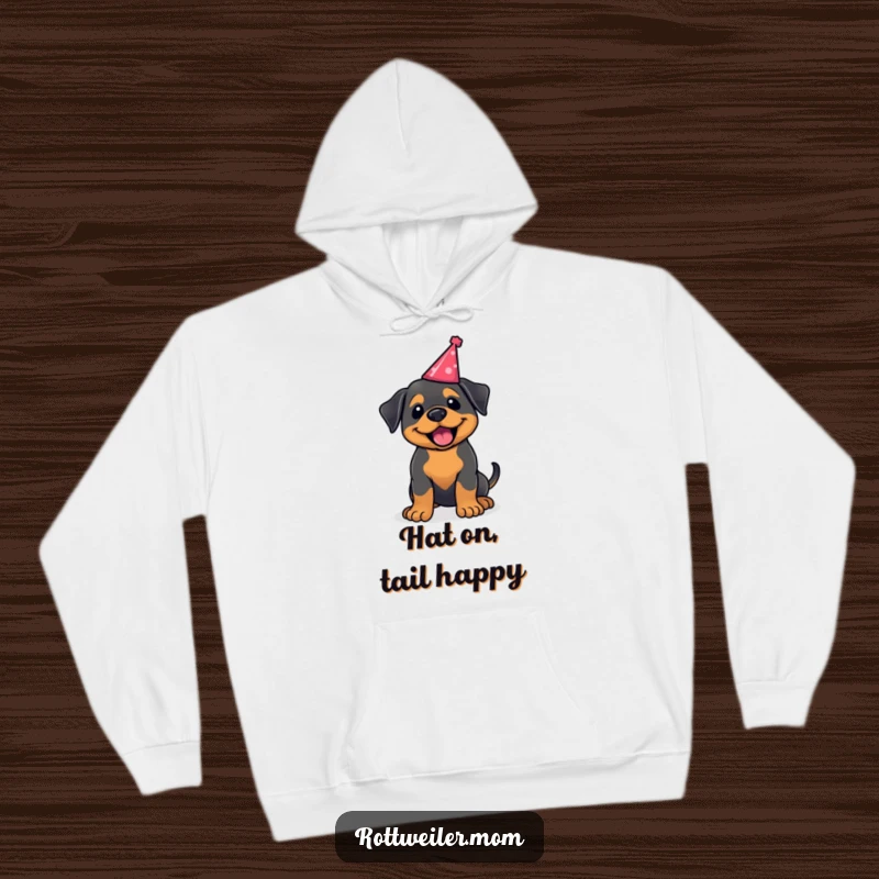 Funny kawaii Rottweiler hoodie, a cozy hoodie with a happy dog wagging its tail in a party hat. Warm and celebratory.
