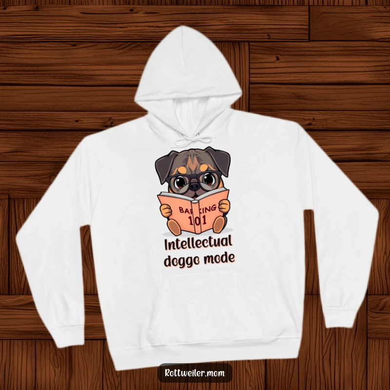 Funny hoodie showcasing a Rottweiler with spectacles engrossed in a massive book titled Barking 101, a studious pup.