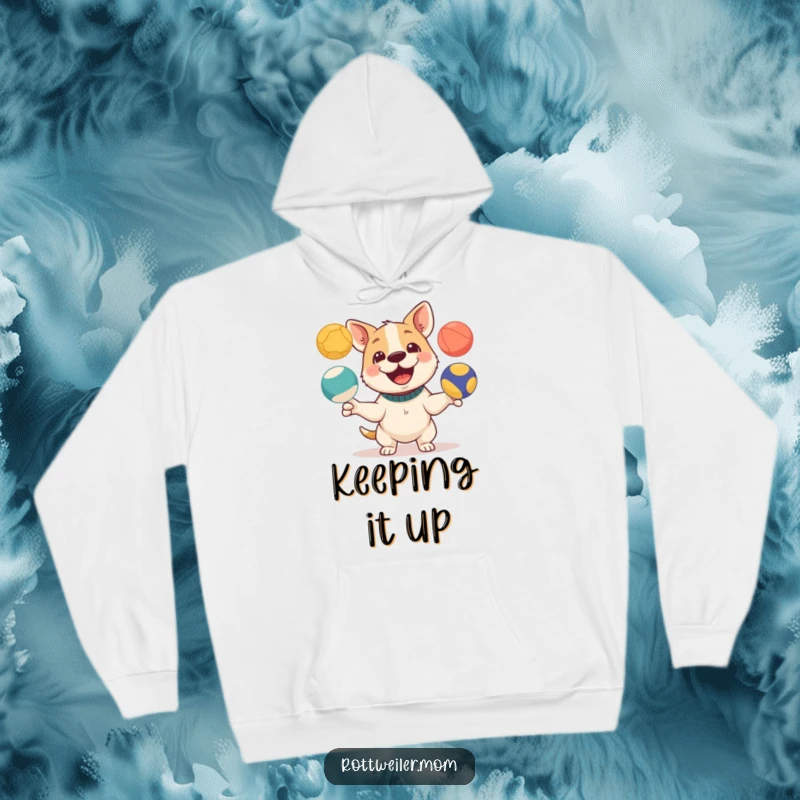 Funny hoodie featuring a dog with a playful expression juggling three colorful balls, ideal for cozy, entertaining wear.