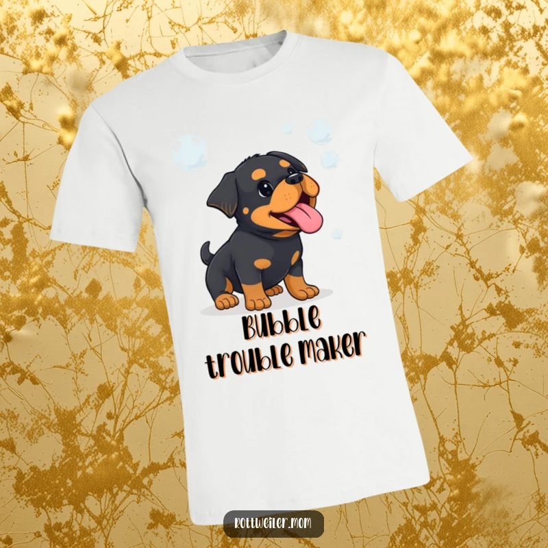 Funny Kawaii Rottweiler, with tongue hanging out, playfully stalks and tries to catch shimmering bubbles on a t-shirt.