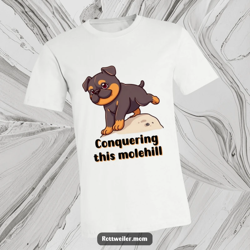 Funny Kawaii Rottweiler T-Shirt depicting a cute dog with a serious expression, actively climbing a small, grassy hill.