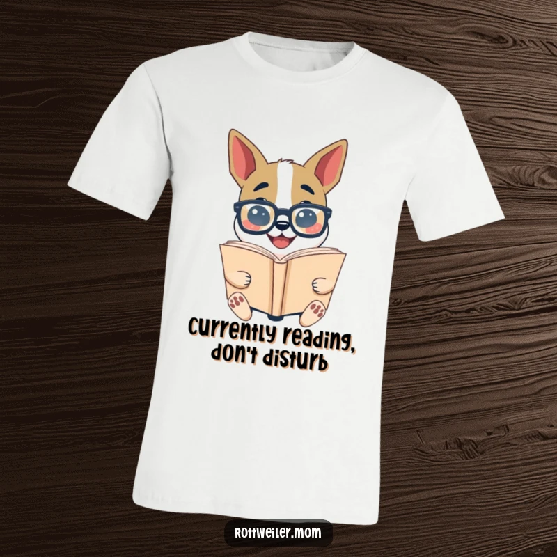 Funny Bookworm Dog T-Shirt: A dog in big glasses reads a giant book, perfect humorous attire for readers.