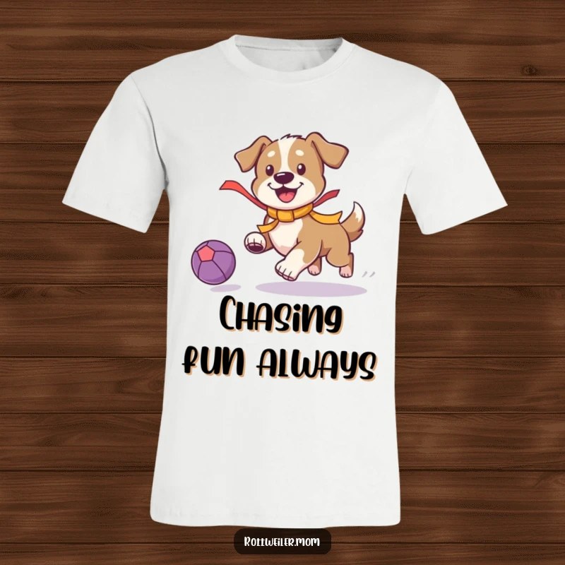 Funny Playful Dog T-Shirt: Dog with a bright ribbon chases a bouncing ball, capturing fun and motion.