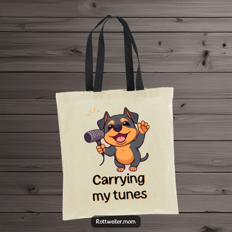 Funny Rottweiler tote bag featuring an excited dog holding a giant microphone, ready for a music-filled day, practical and humorous.