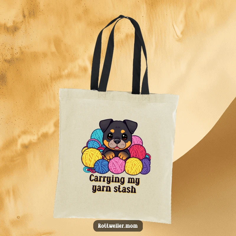 Funny Kawaii Rottweiler peeking from yarn balls on a tote bag, a humorous and functional accessory.