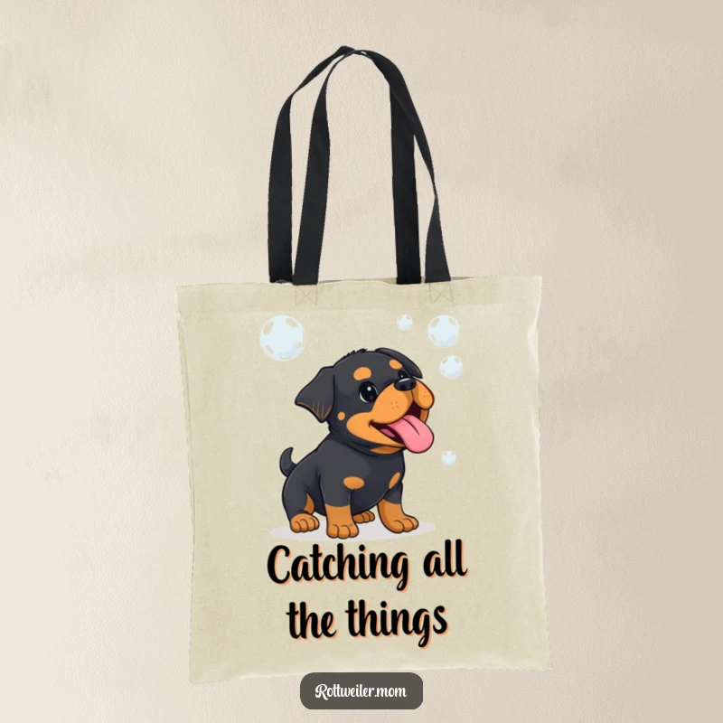 Funny Kawaii Rottweiler with tongue sticking out, playfully jumping to catch floating bubbles on a tote bag.