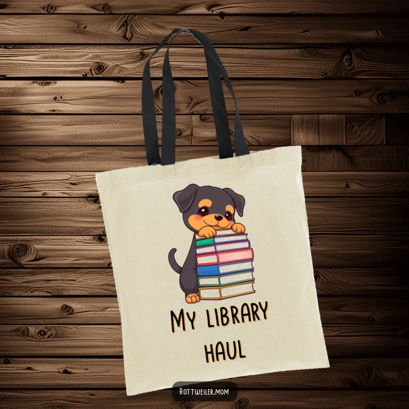 Funny Rottweiler tote bag featuring a determined dog wagging its tail while balancing a stack of books, ideal for book carriers.